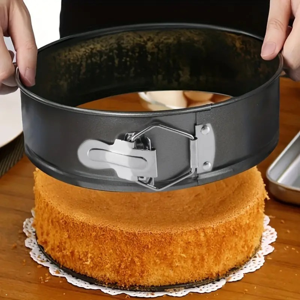 4-piece non-stick springform cake pan in round black baking tray.