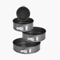 4-piece non-stick springform cake pan in round black baking tray.