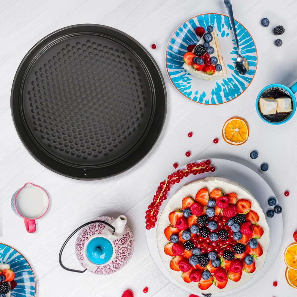 4-piece non-stick springform cake pan in round black baking tray.