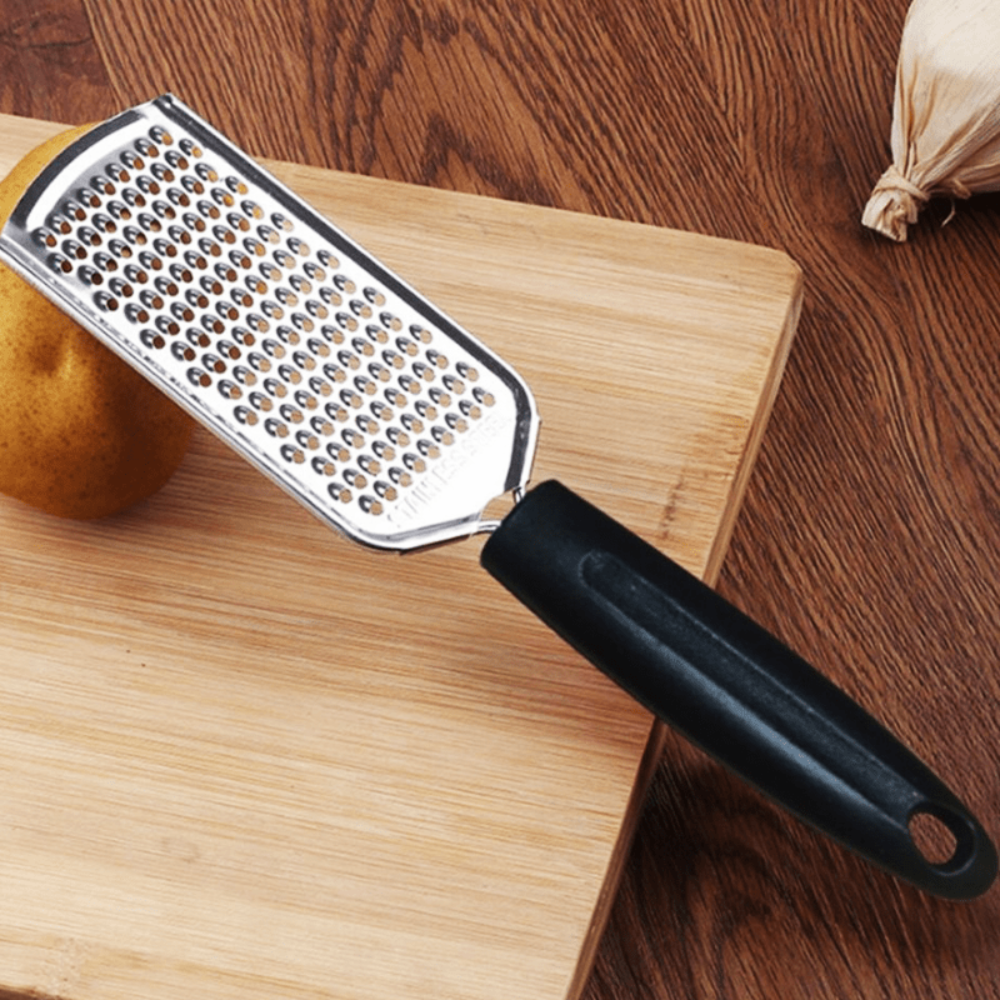 Hand-held Cheese, Ginger, and Chocolate Grater with Sharp Blades and Razor for Kitchen Use.