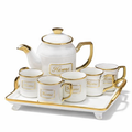 Luxury ceramic tea and coffee set with teapot, cups and tray with gold accents for elegant serving