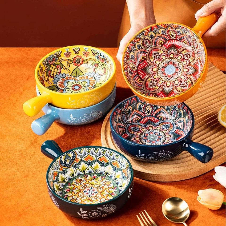 Colorful ceramic bowls with intricate patterns on a wooden surface.